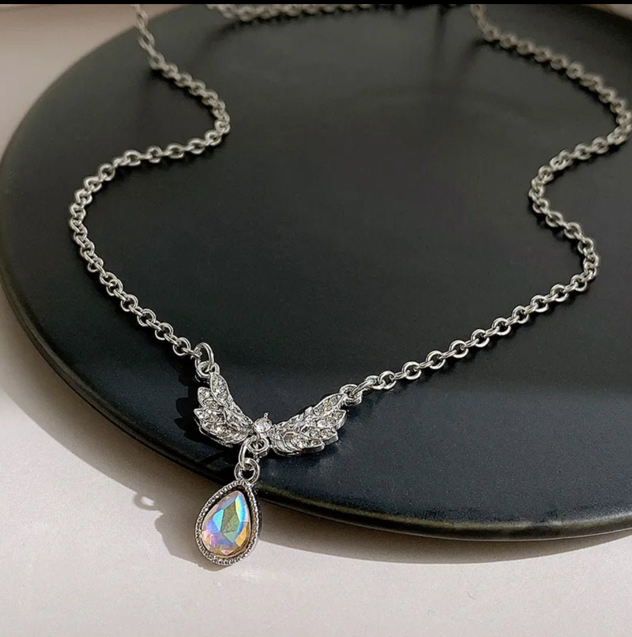 Wings rhinestone detailed pendant