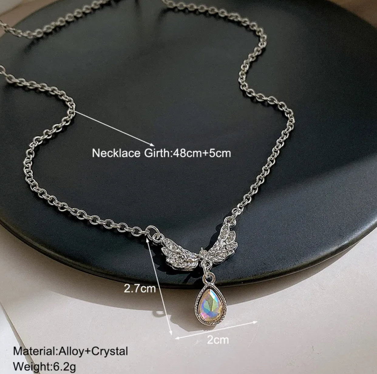 Wings rhinestone detailed pendant